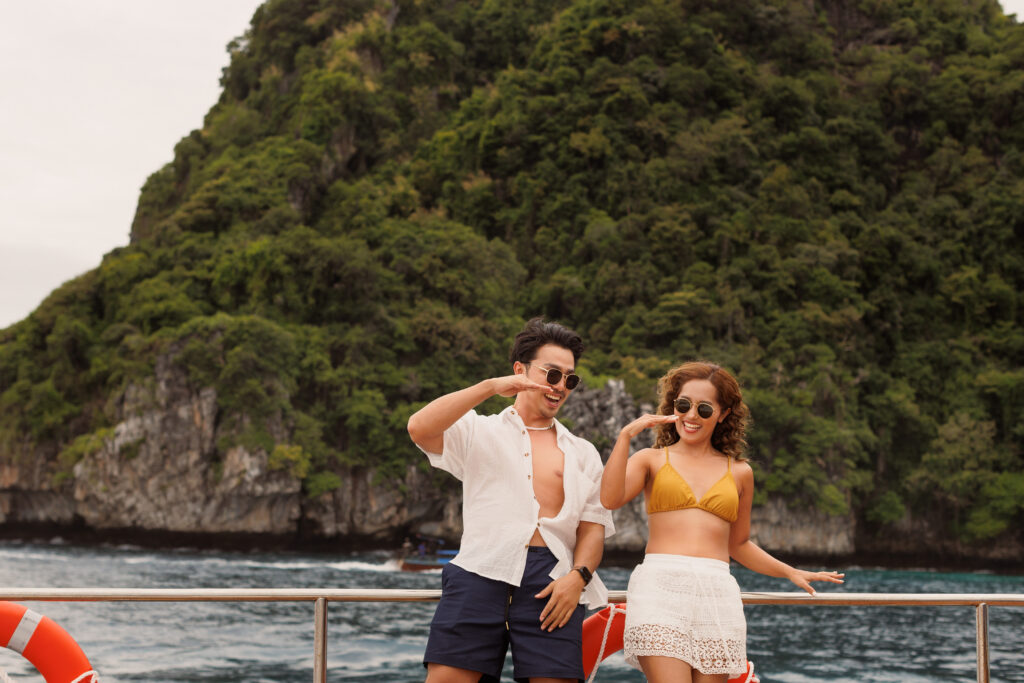 Couple enjoying limestone-cliff views at Phi Phi on Meka Catamaran